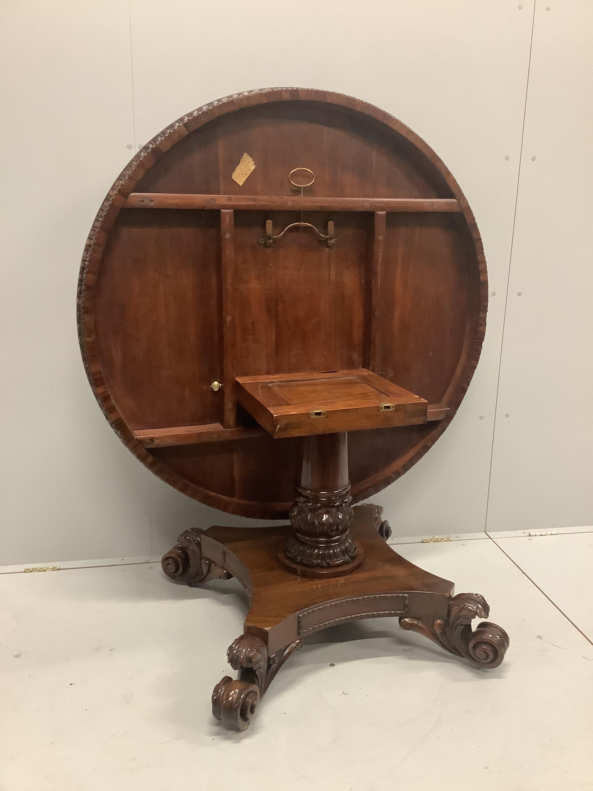 A William IV circular rosewood tilt top pedestal dining table, diameter 121cm, height 72cm